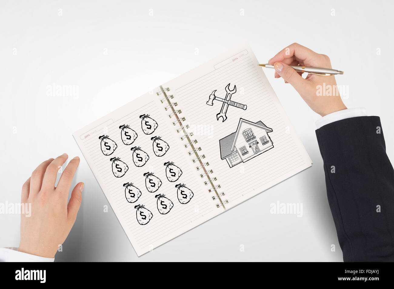 Imprenditore disegno le mani per far soldi formula nel blocco note Foto Stock