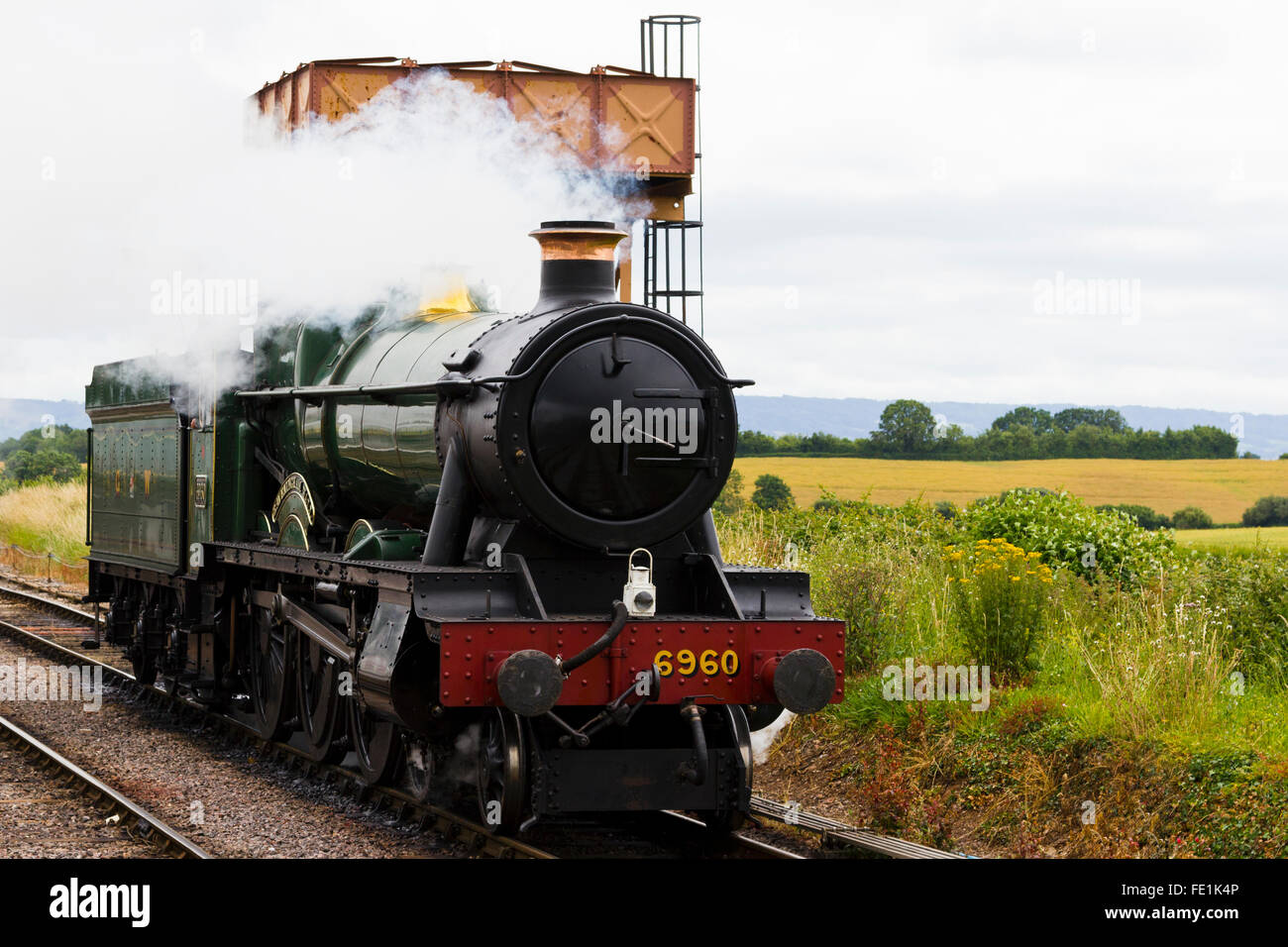 Treno a vapore avvicinando Watchet stazione sul West Somerset Railway, REGNO UNITO Foto Stock