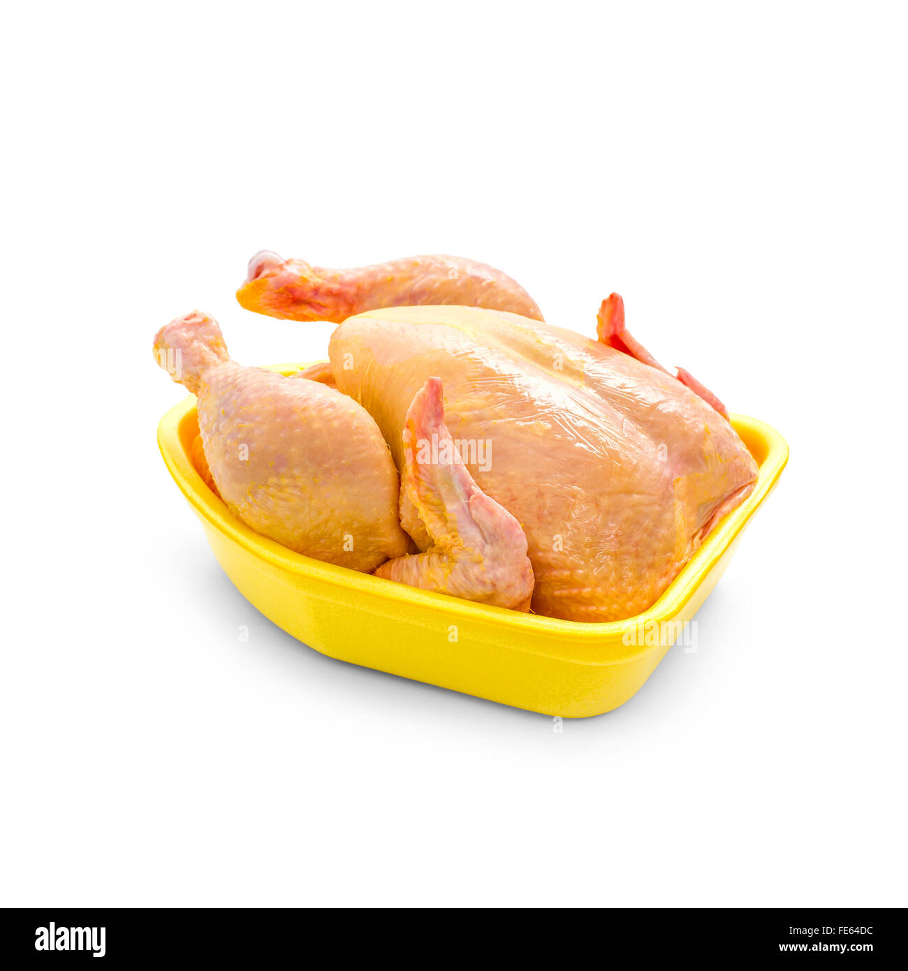 Pollo nutrito con mais in giallo il confezionamento di vassoio su sfondo bianco Foto Stock