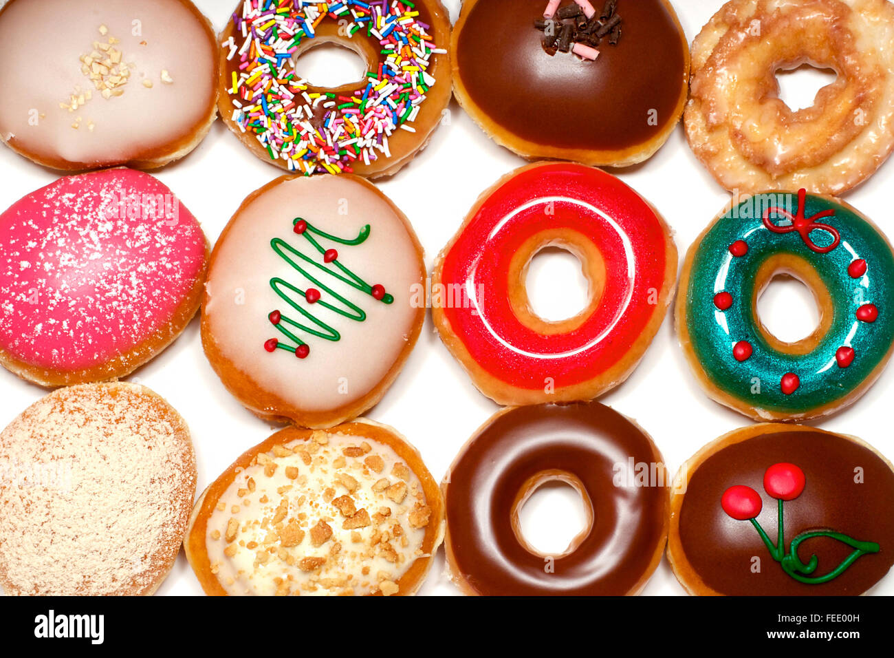 Dodici diversi ciambella nel libro bianco box Foto Stock