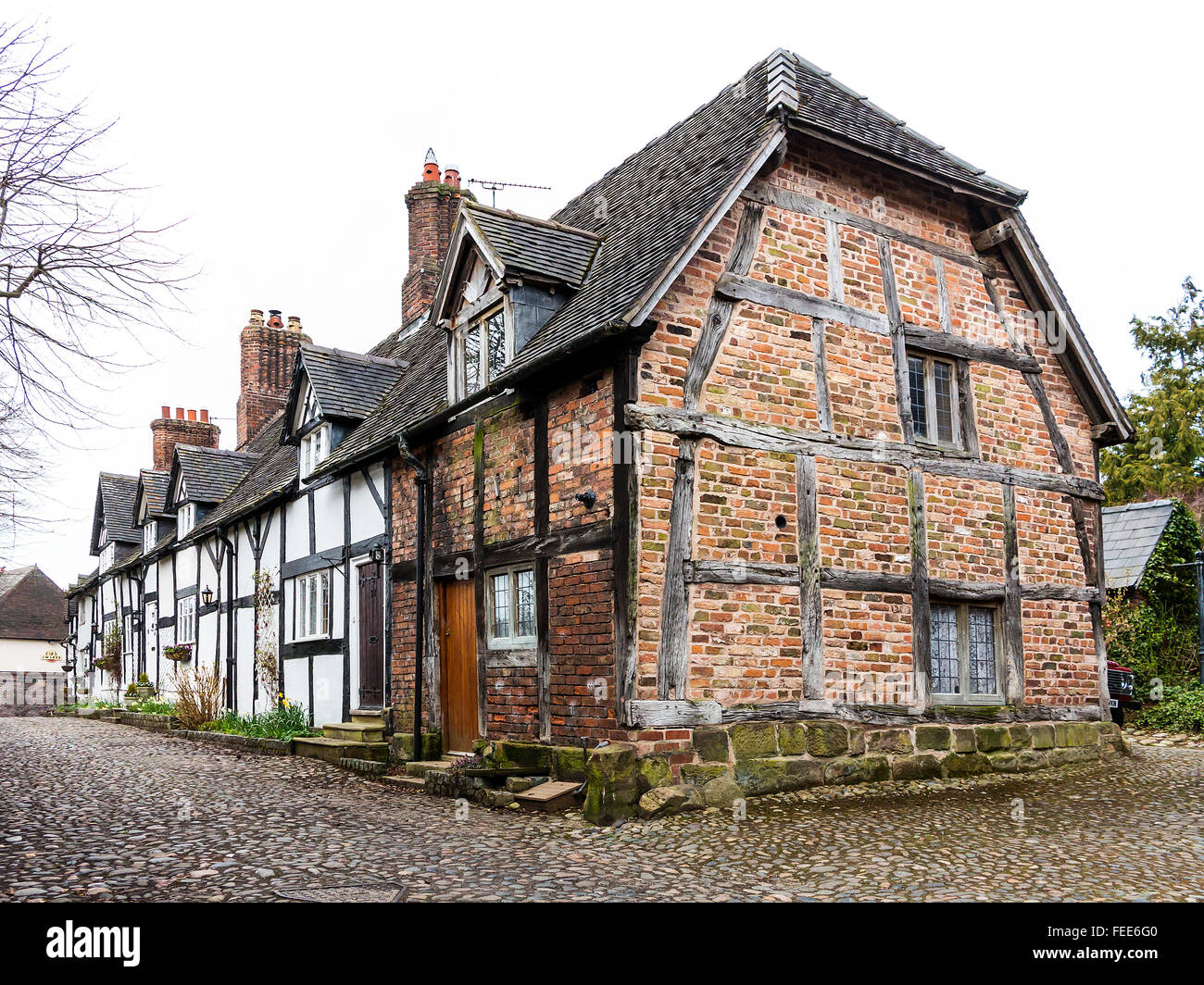Legname rurale incorniciato cottages in grande Budworth, Cheshire, Inghilterra, Regno Unito Foto Stock