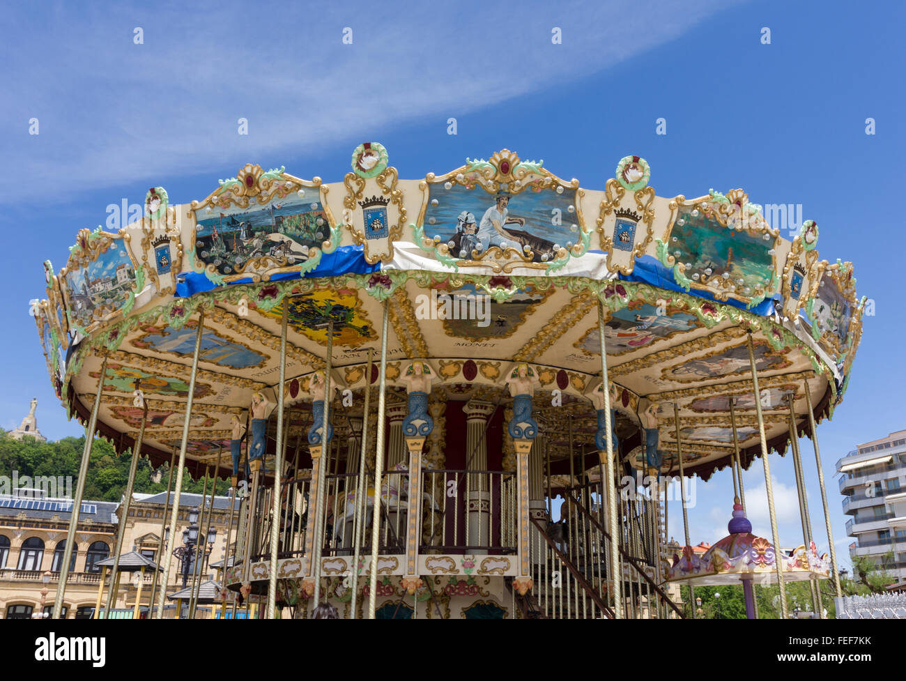 Merry-go-round, giostra, parco, San Sebastian con foto di artisti famosi Foto Stock