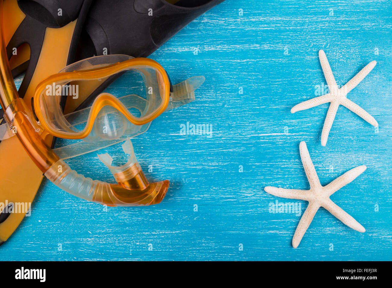 Kit snorkel e stelle marine Foto Stock