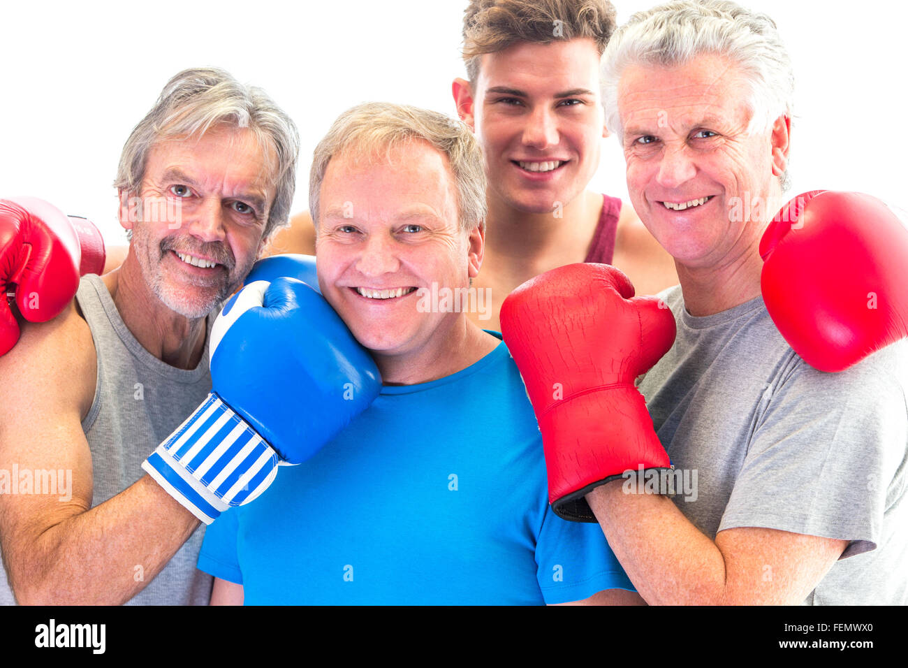 Tre alti uomini guanti in posa con loro trainer Foto Stock