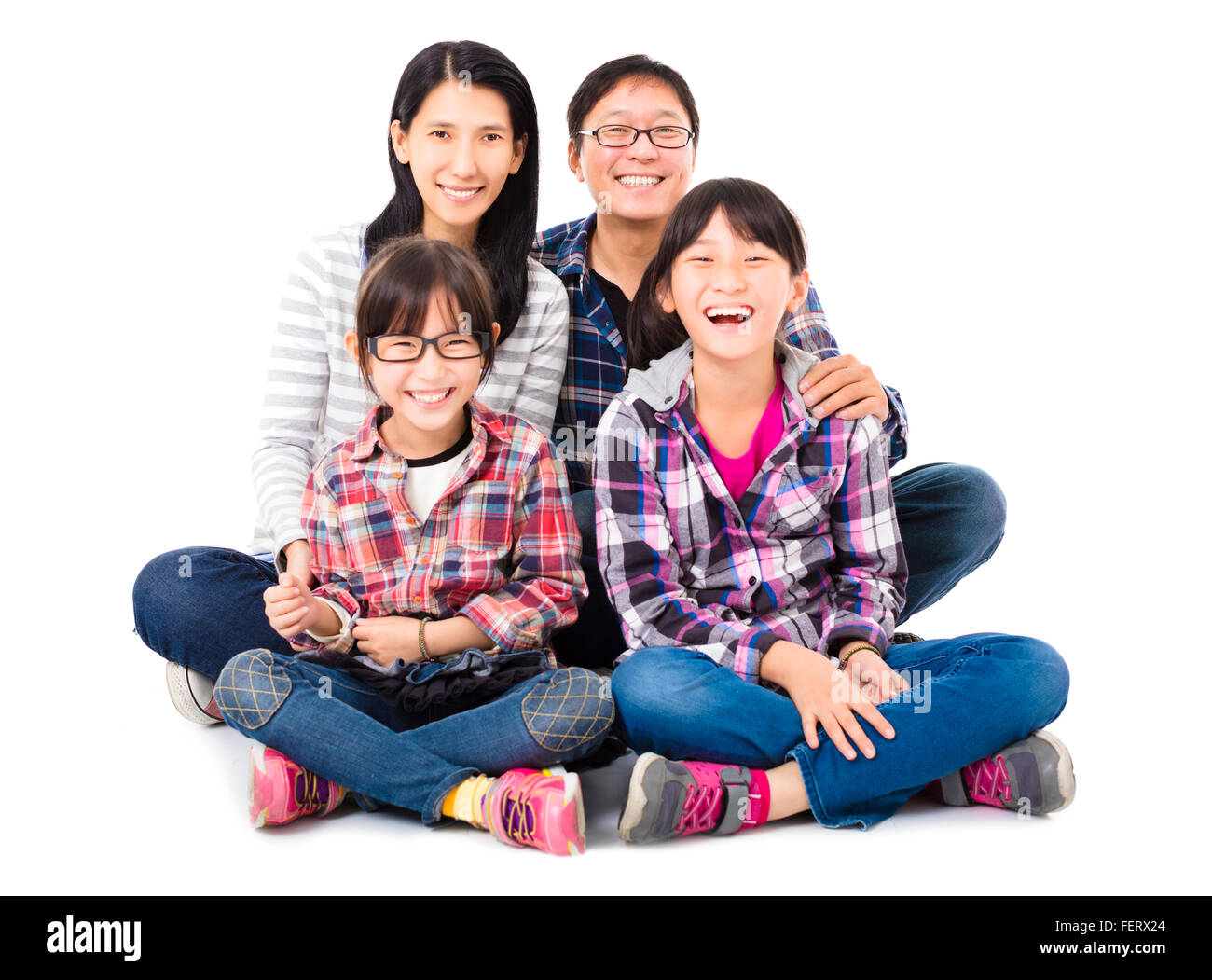 Felice famiglia asiatica seduti insieme Foto Stock