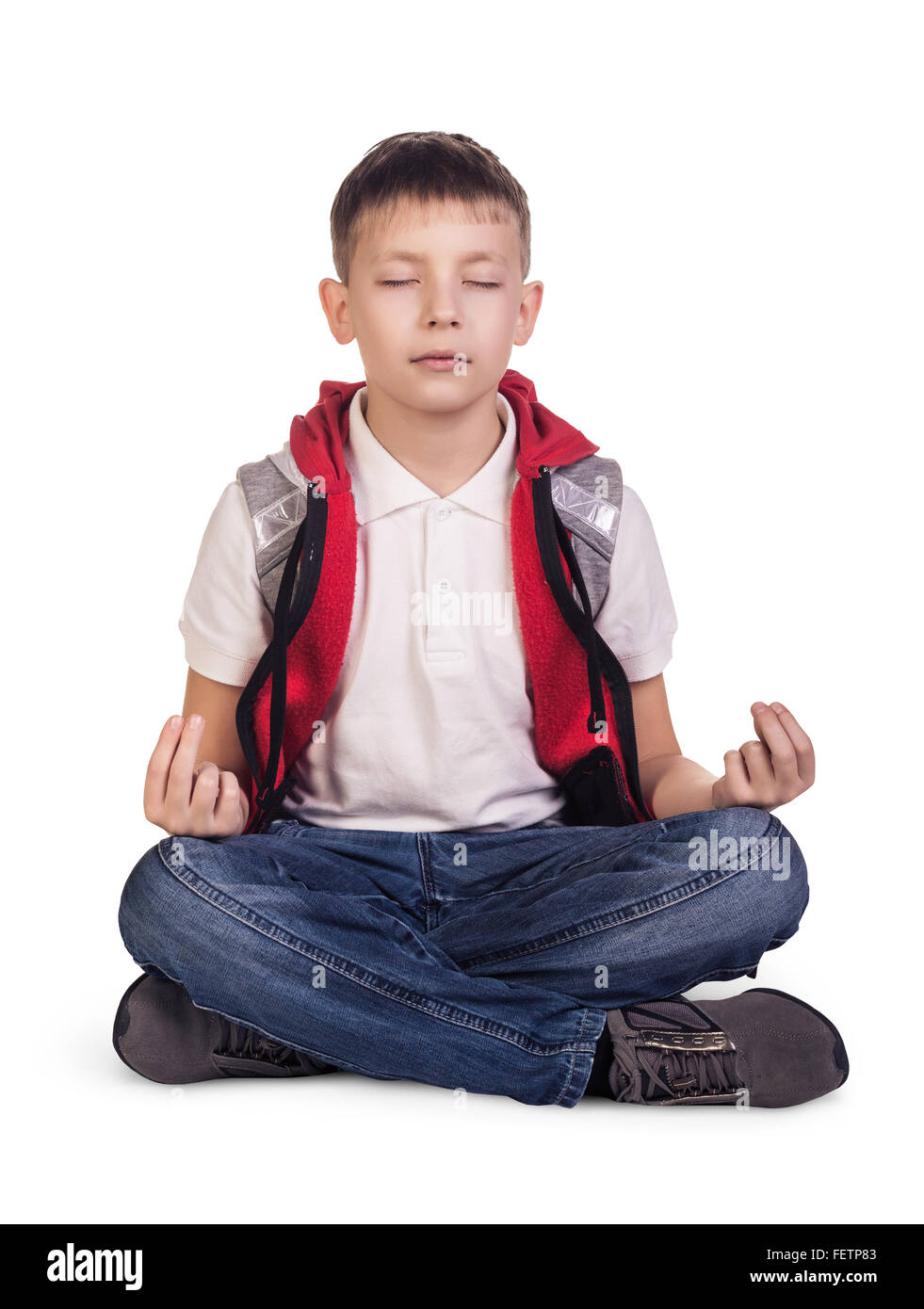 Poco carino boy meditando Foto Stock