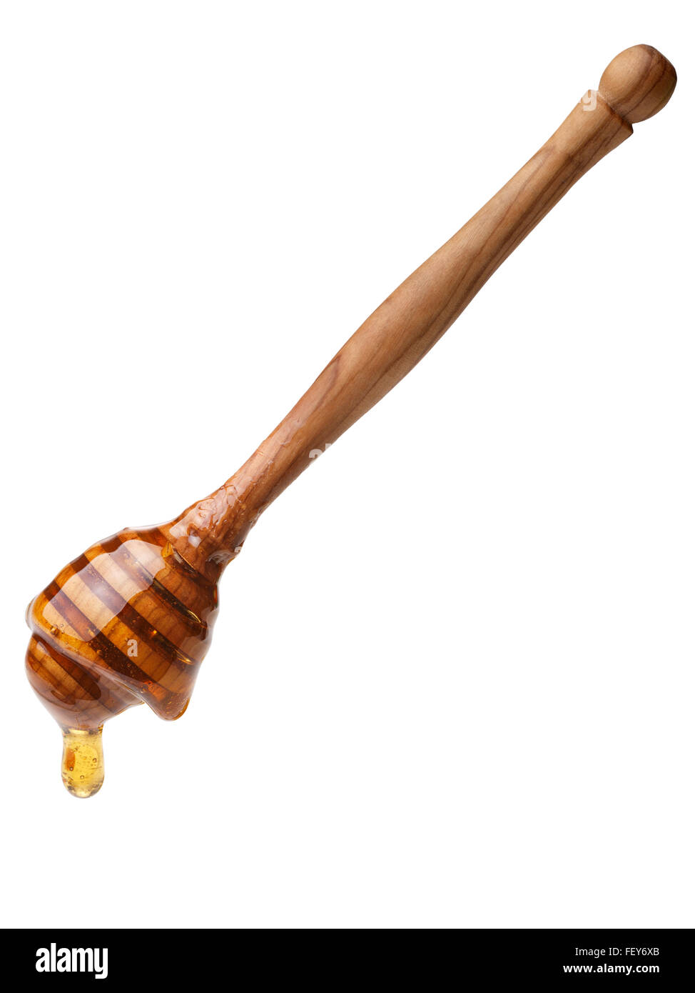 Il miele in legno il bilanciere con miele di gocciolamento. Grande profondità di campo,tracciato di ritaglio Foto Stock