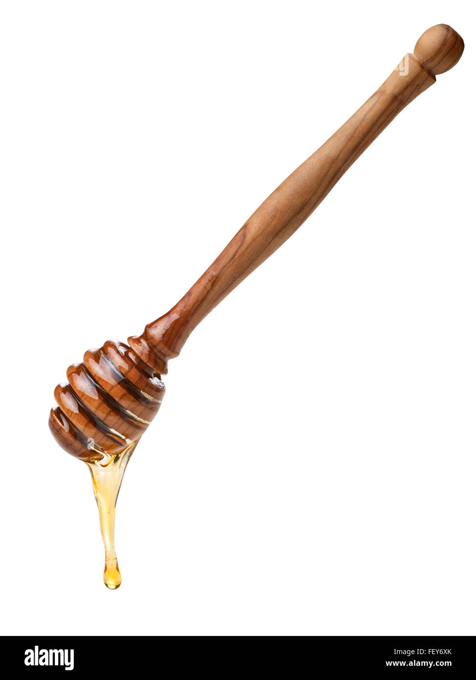 Il miele in legno il bilanciere con miele di gocciolamento. Grande profondità di campo,tracciato di ritaglio Foto Stock