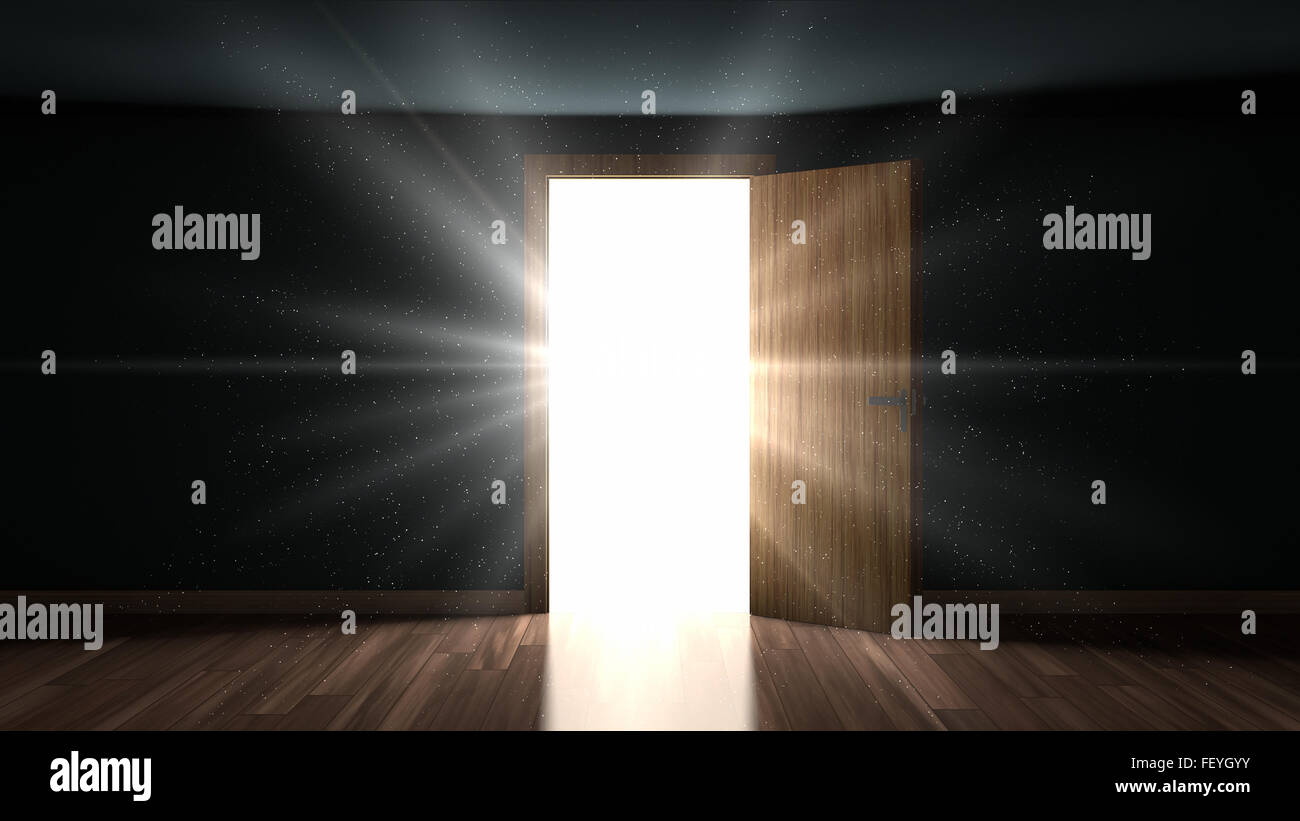 Luce e particelle in una stanza buia attraverso l'apertura della porta Foto Stock