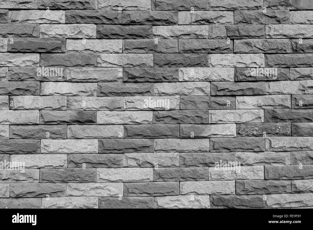 Vintage colorati muro di pietra la texture dello sfondo. Foto Stock