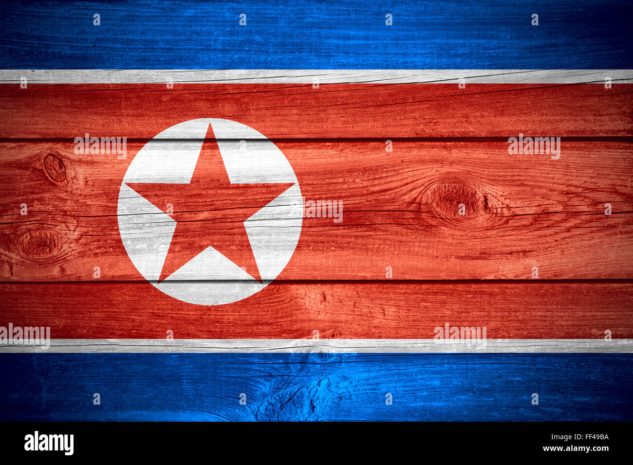 Bandiera della Corea del Nord o Corea del Nord banner su sfondo di legno Foto Stock