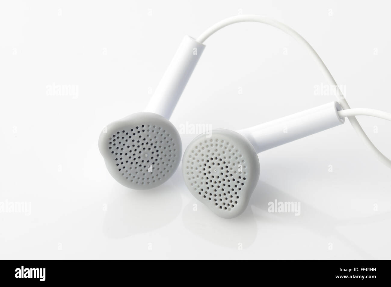 Auricolare in grigio e a colori bianco Foto Stock