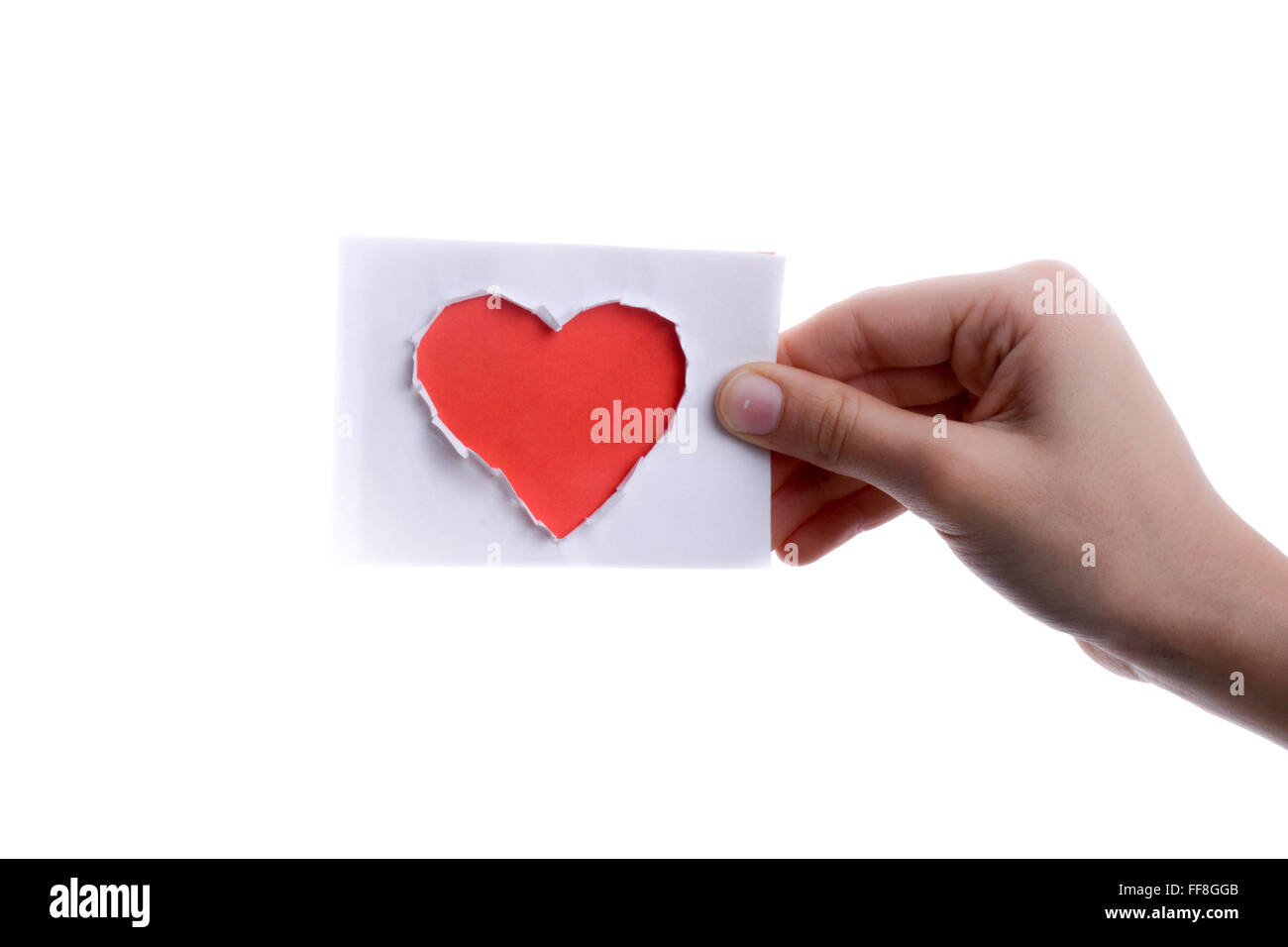 Mano che regge un cuore di carta di forma Foto Stock