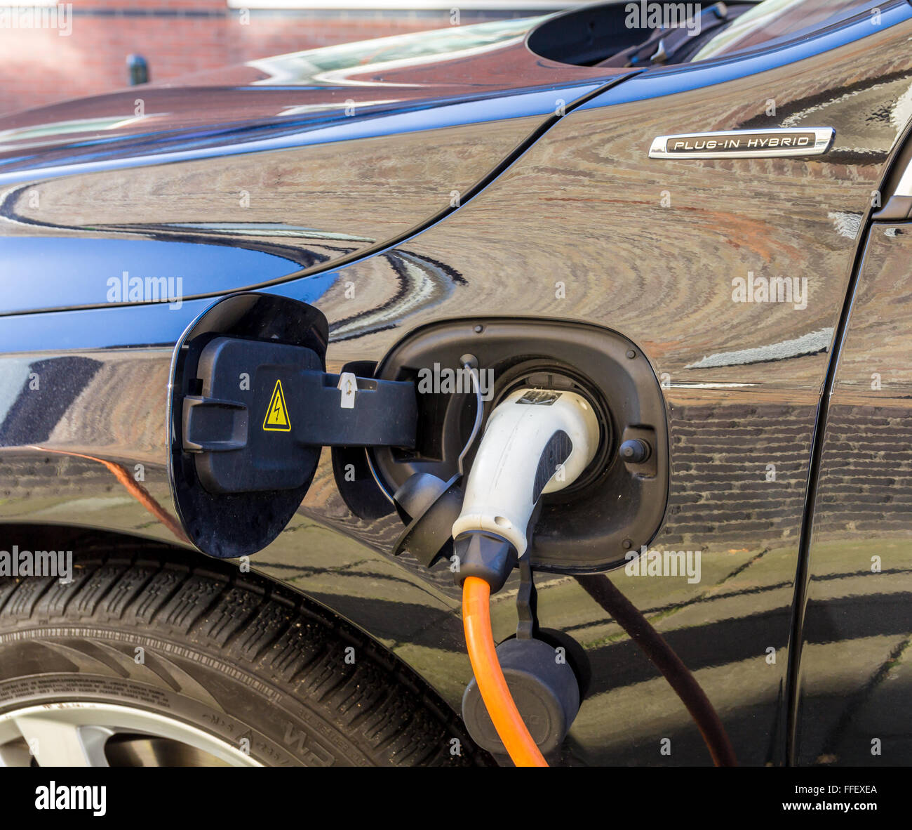 Plug in hybrid electric car punto di carica Foto Stock