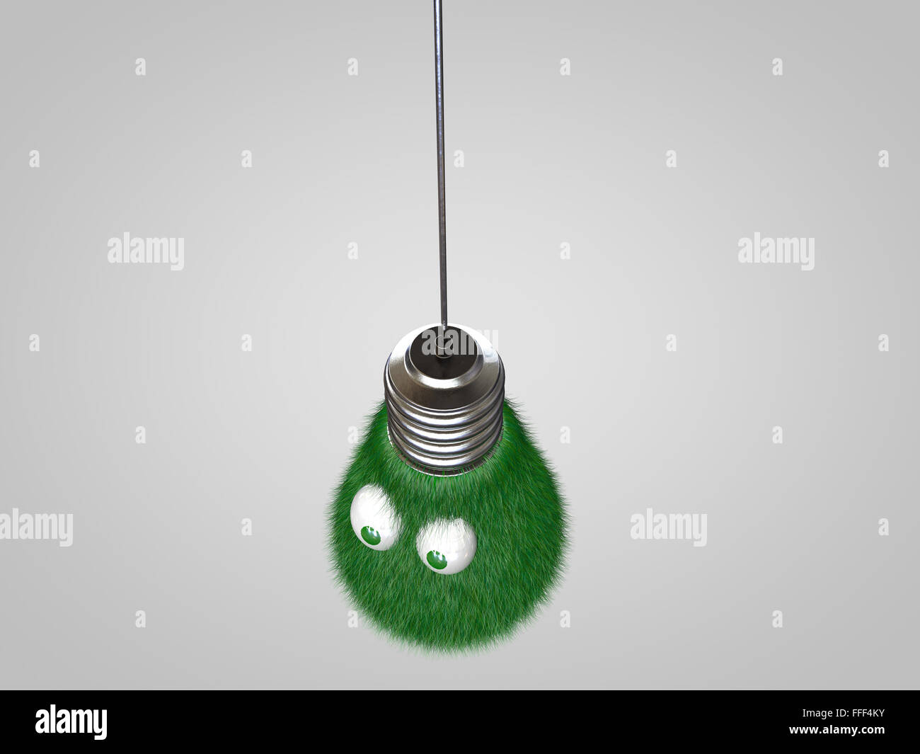 Lampadina della luce con gli occhi coperti in erba verde. Foto Stock