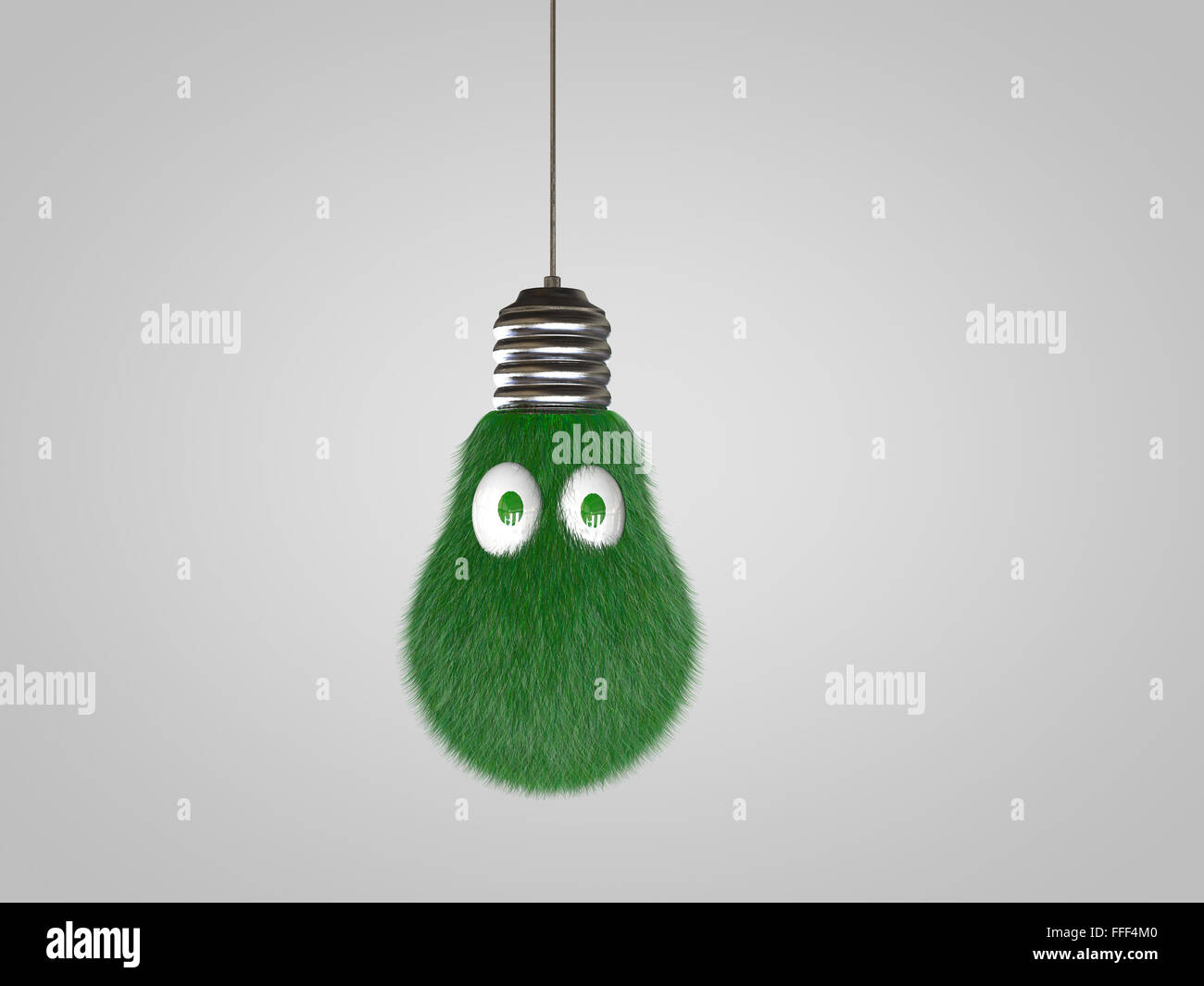 Lampadina della luce con gli occhi coperti in erba verde. Foto Stock