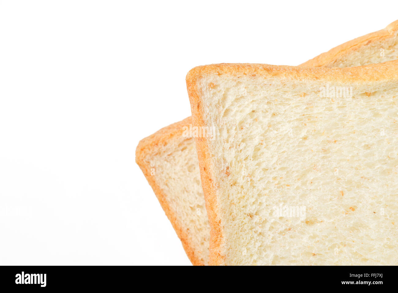 Fette di pane su sfondo bianco Foto Stock