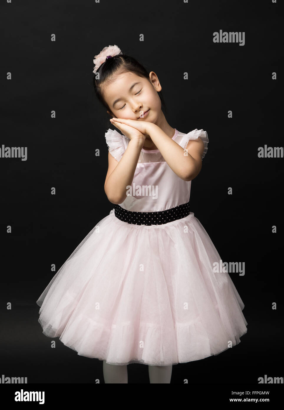 Dreaming Asian ragazza giovane Foto Stock