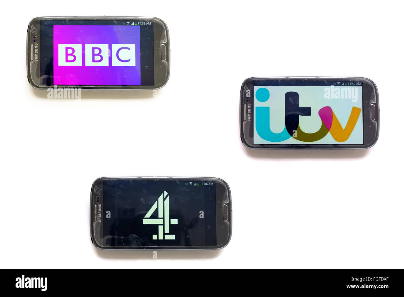 Il logo di TV inglese aziende sulle schermate dello smartphone fotografati contro uno sfondo bianco. Foto Stock