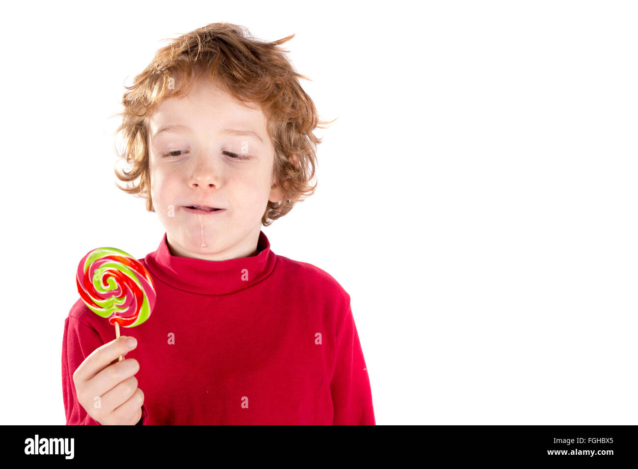 Mangiare Boy Lollipop isolati su sfondo bianco Foto Stock