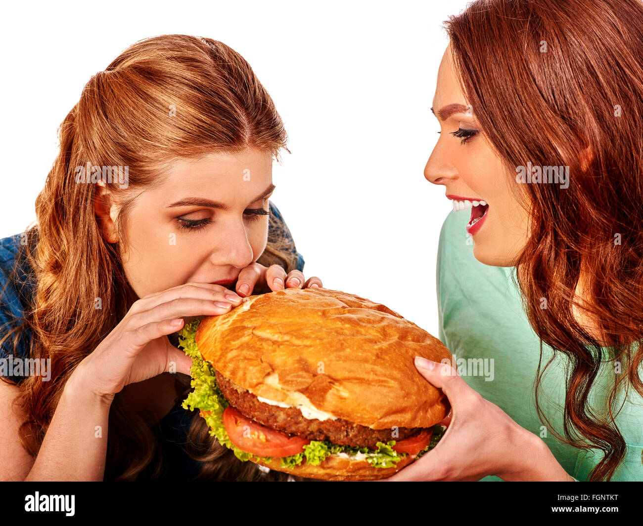 Ragazza di mangiare grandi sandwich. Foto Stock