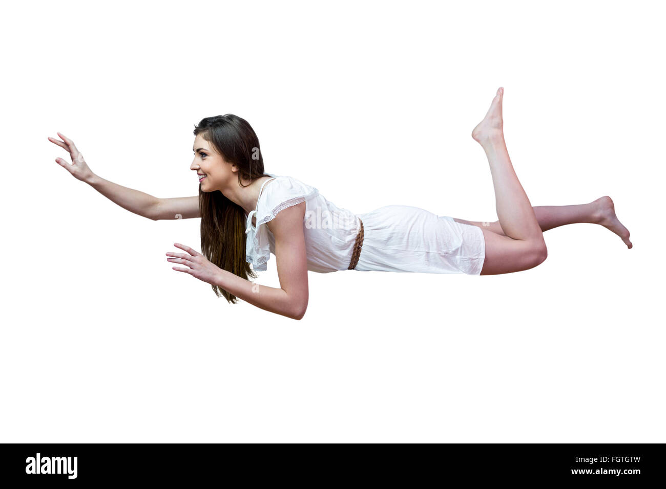 Ragazza in abito bianco galleggianti in aria Foto Stock