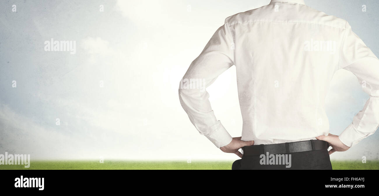 Imprenditore con prato Foto Stock
