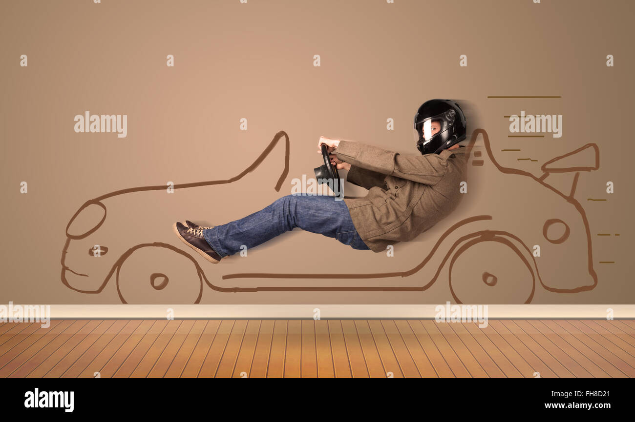 Felice l'uomo alla guida di una mano vettura disegnata sulla parete Foto Stock