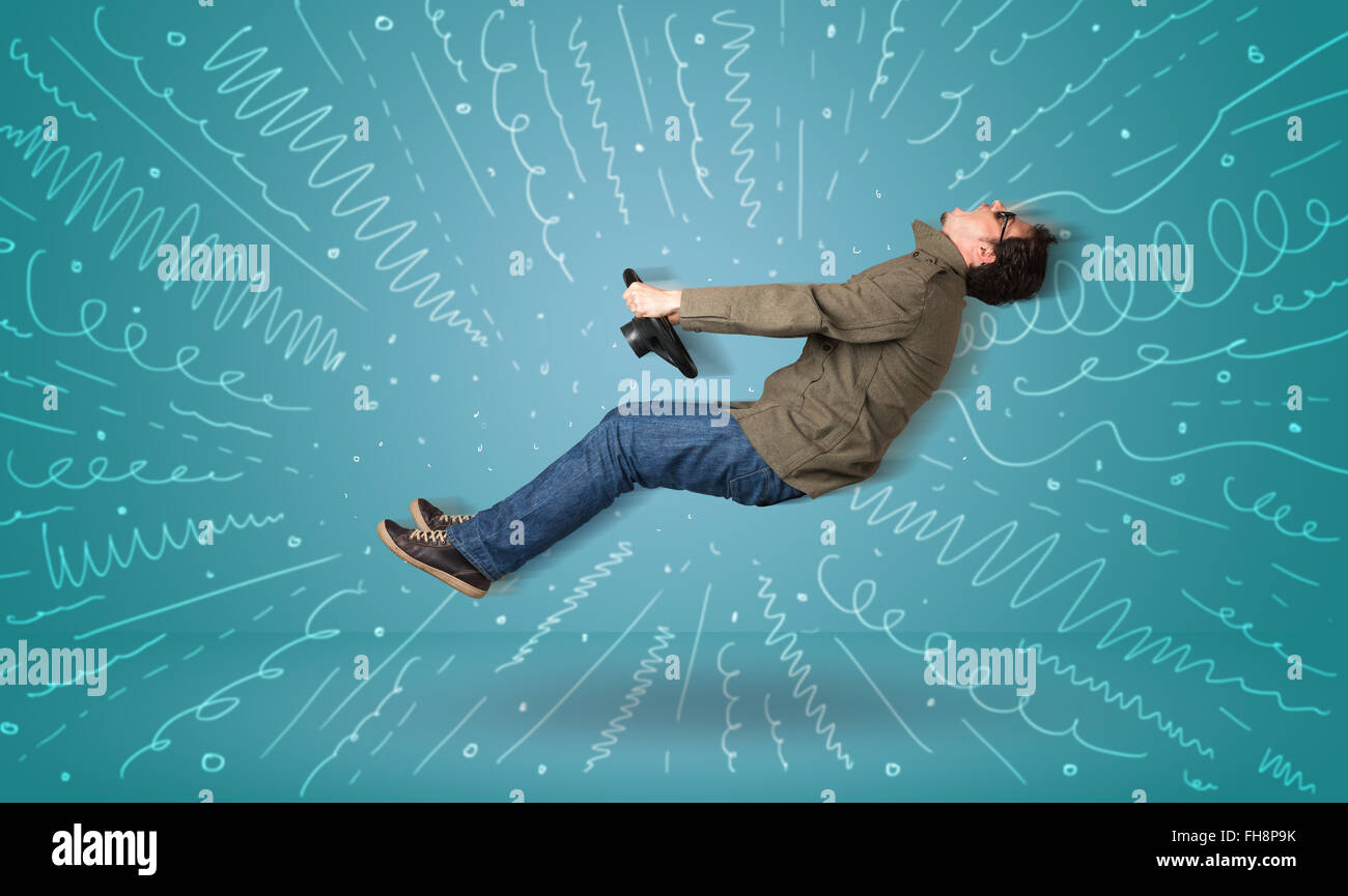 Funny guy aziona un immaginario veicolo con linee tracciate intorno a lui Foto Stock