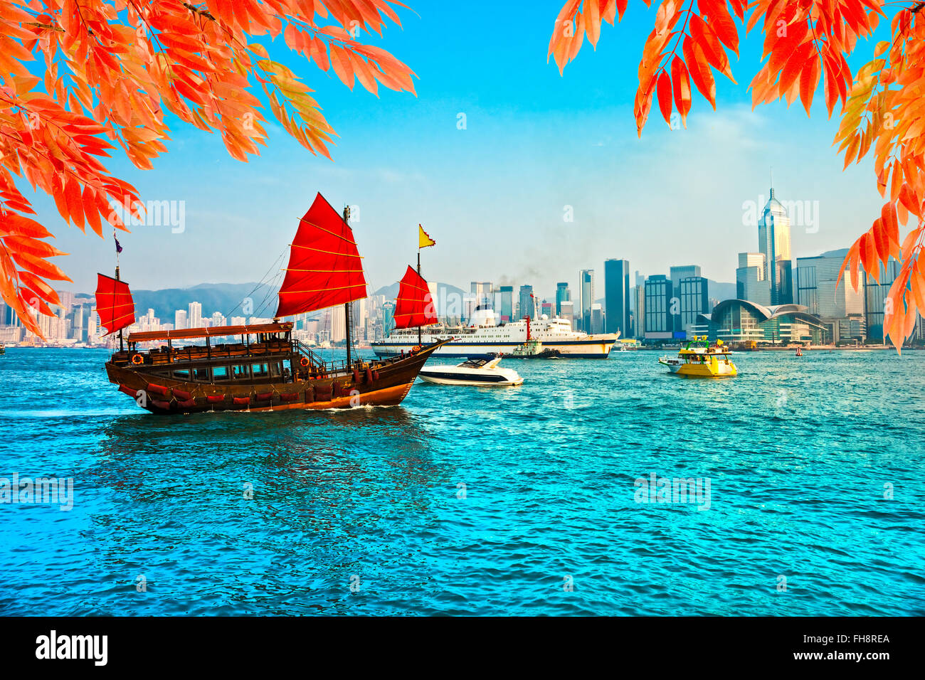 Porto di Hong Kong al tramonto. Foto Stock