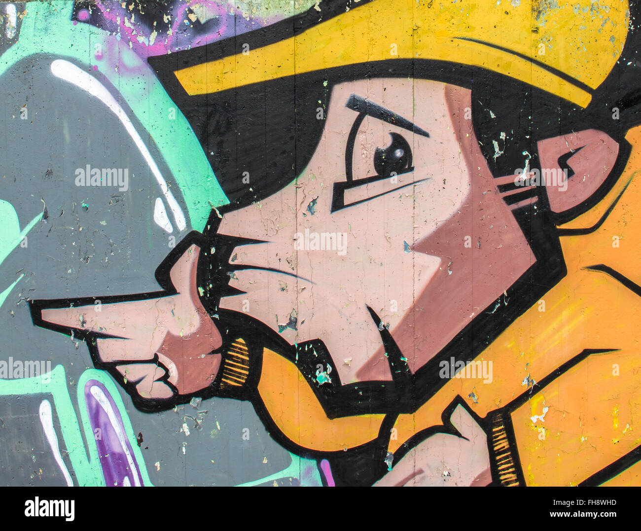 Hipster, rapper indossando un cappello. Urban graffiti. Foto Stock