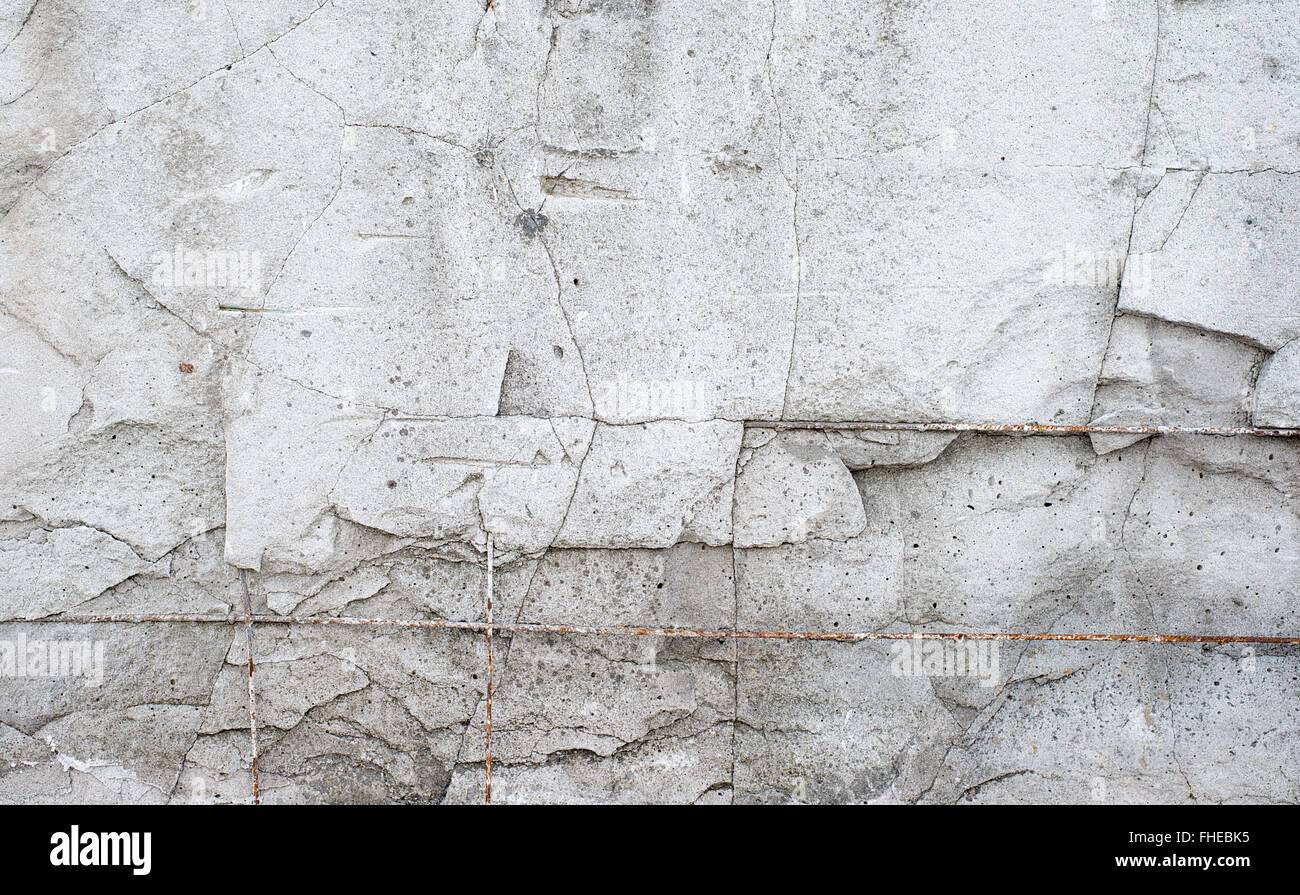 La texture muro di cemento di costruzione distrutti con raccordi Foto Stock