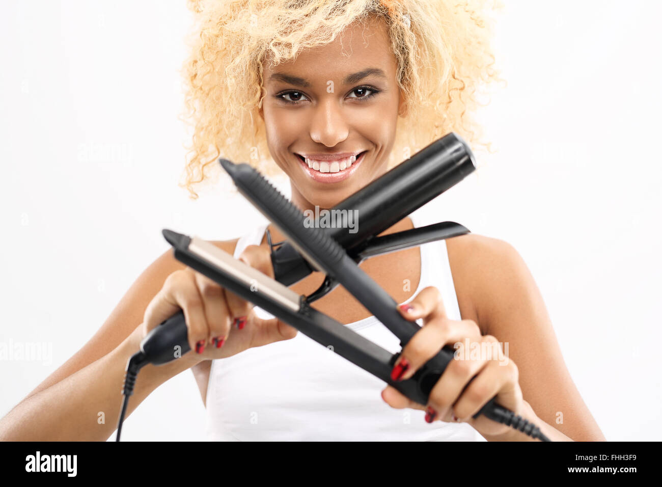 La posa di capelli o ferro arricciacapelli. La lussureggiante di ricci, afro  hairstyle Foto stock - Alamy