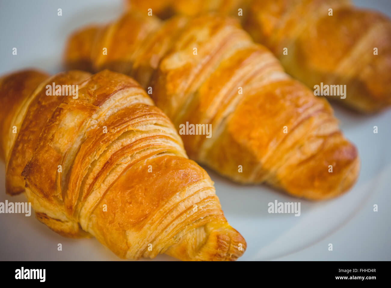 Piastra del croissant presso la stazione di ordine Foto Stock