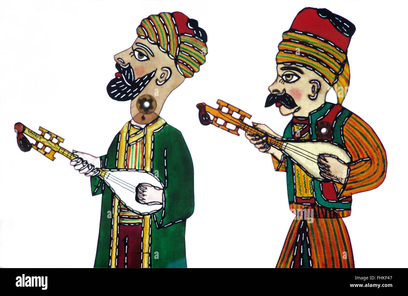 Ombra burattini di due turche i musicisti folk giocando Saz o Baglama gli strumenti a corda. I caratteri da Karagöz e Hacivat Shadow Puppet Theatre o gioco di ombre Foto Stock