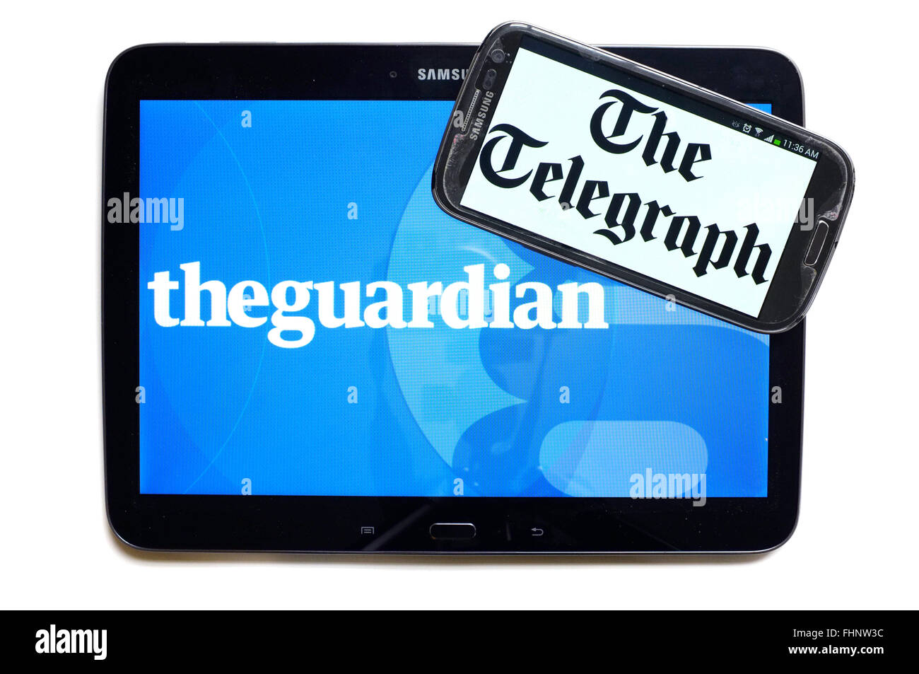 I loghi del tutore e il Telegraph quotidiani visualizzati sugli schermi di un tablet e uno smartphone. Foto Stock