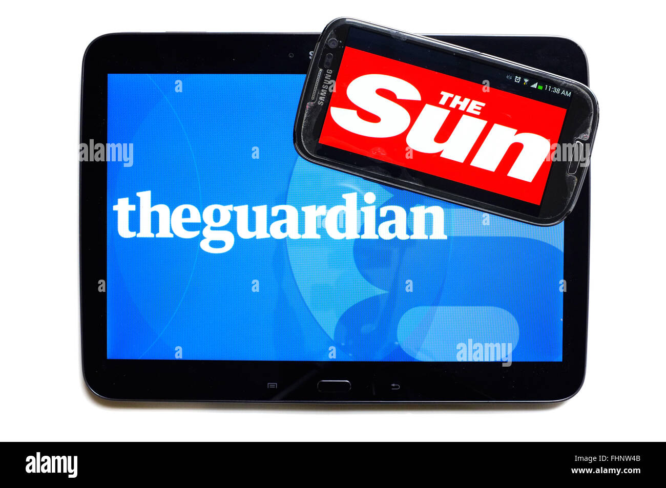 I loghi del tutore e il sole quotidiani visualizzati sugli schermi di un tablet e uno smartphone. Foto Stock