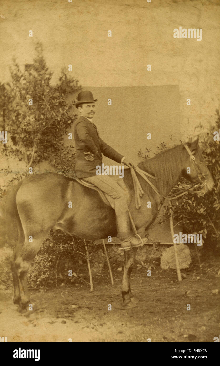 Un uomo a cavallo Foto Stock