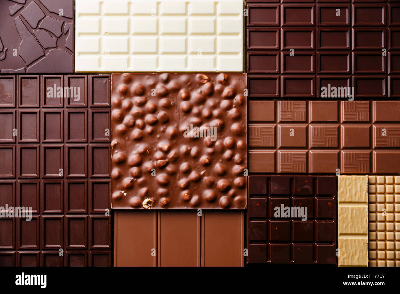 Barra di cioccolato assortimento pattern come sfondo Foto Stock