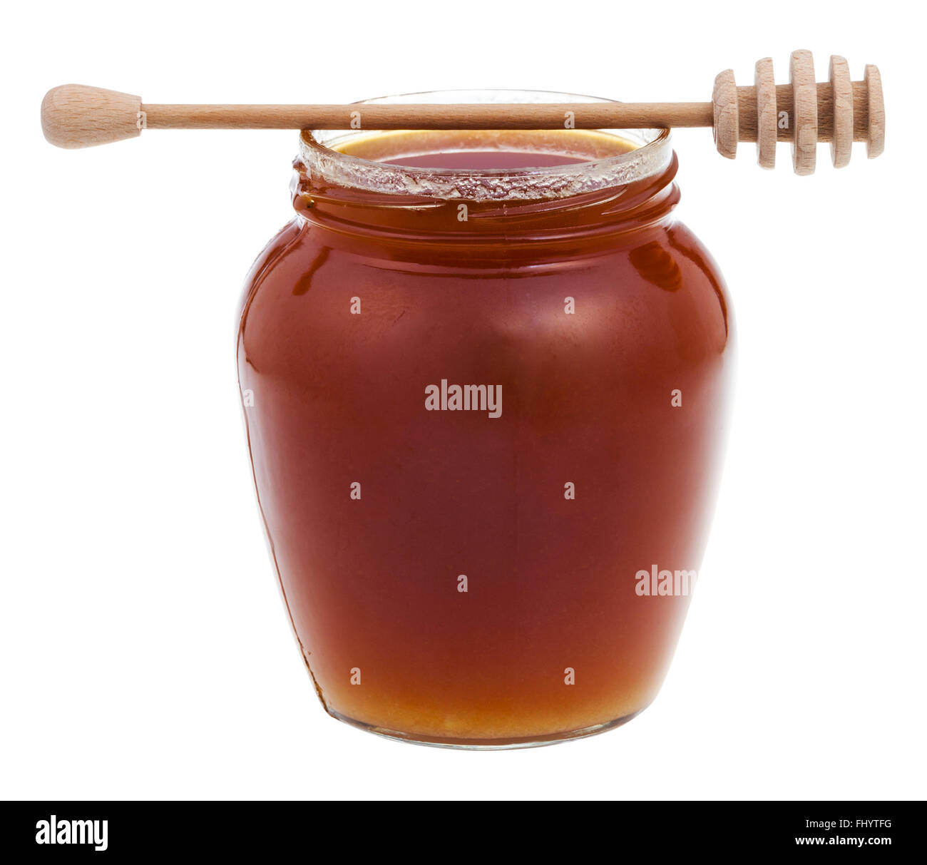 Vista laterale il vasetto di vetro marrone con il miele e il bastone di legno isolato su sfondo bianco Foto Stock