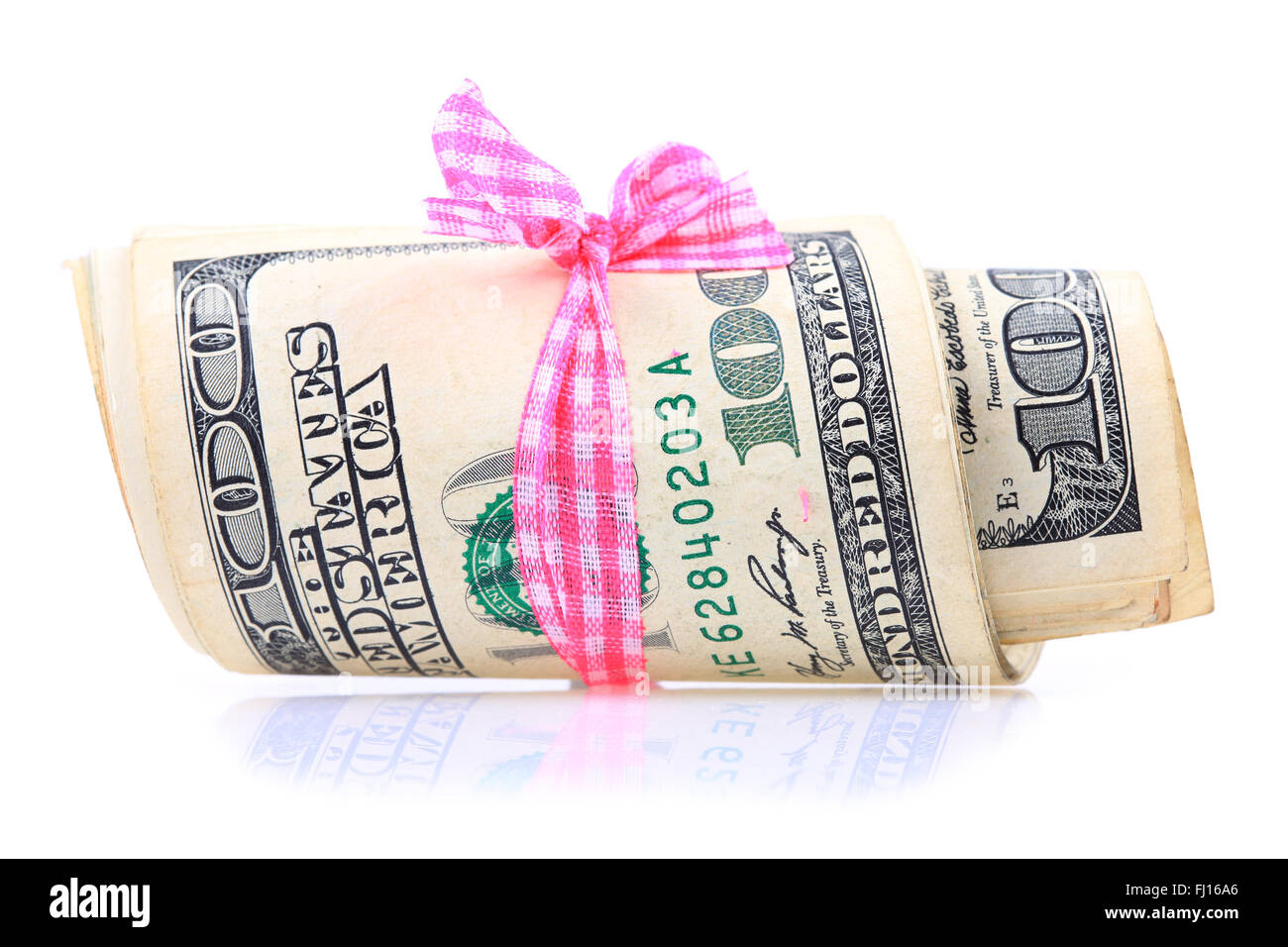 Pila di dollari su sfondo bianco Foto Stock