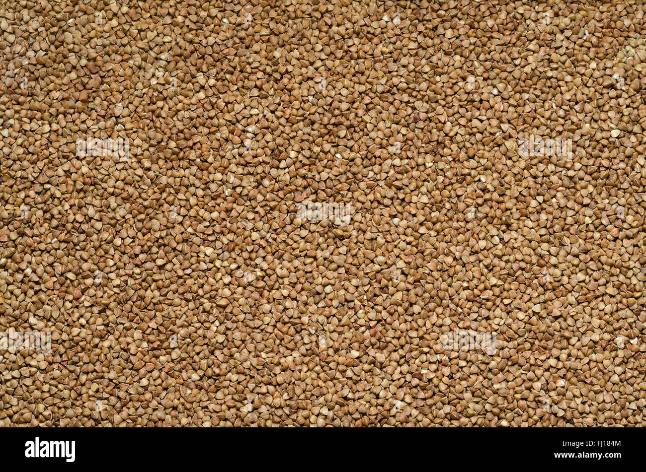 Sfondo di grano saraceno rassypannoj sulla superficie Foto Stock