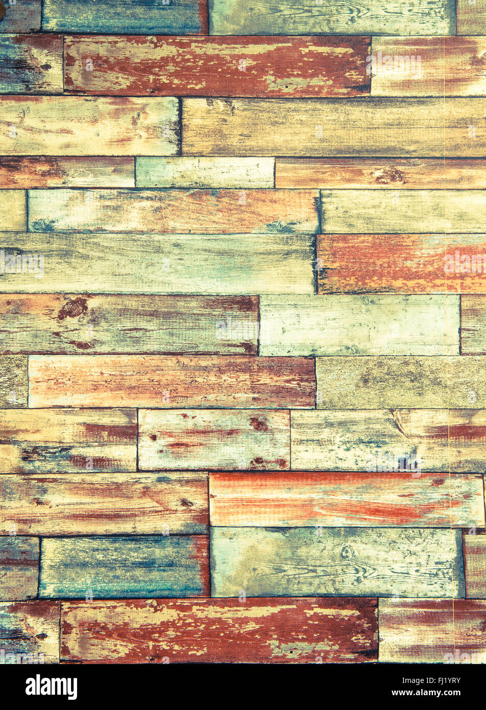 Telaio verticale di psichedelico in mattoni colorati a parete con sfondo rosso giallo verde e colori acidi Foto Stock