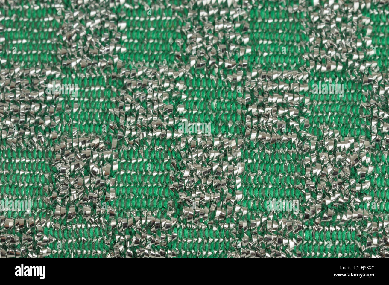 Primo piano della superficie della spugna per pulizia con fili di metallo incorporati Foto Stock