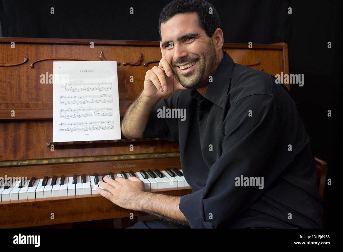 Giocatore pianoforte con pianoforte Foto Stock