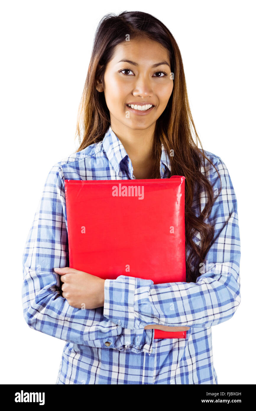 Sorridente donna asiatica azienda libro rosso Foto Stock