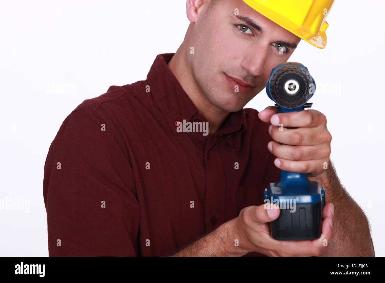 Carpenter utilizzando cordless Foto Stock