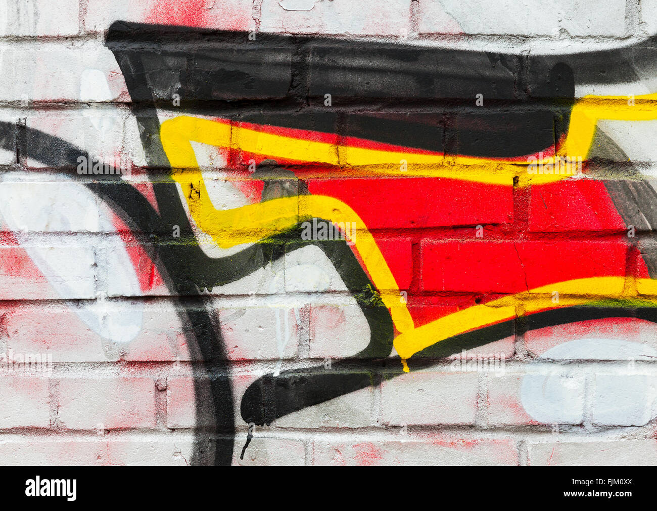 Abstract coloratissimo graffito su frammento urbano vecchio muro di mattoni Foto Stock