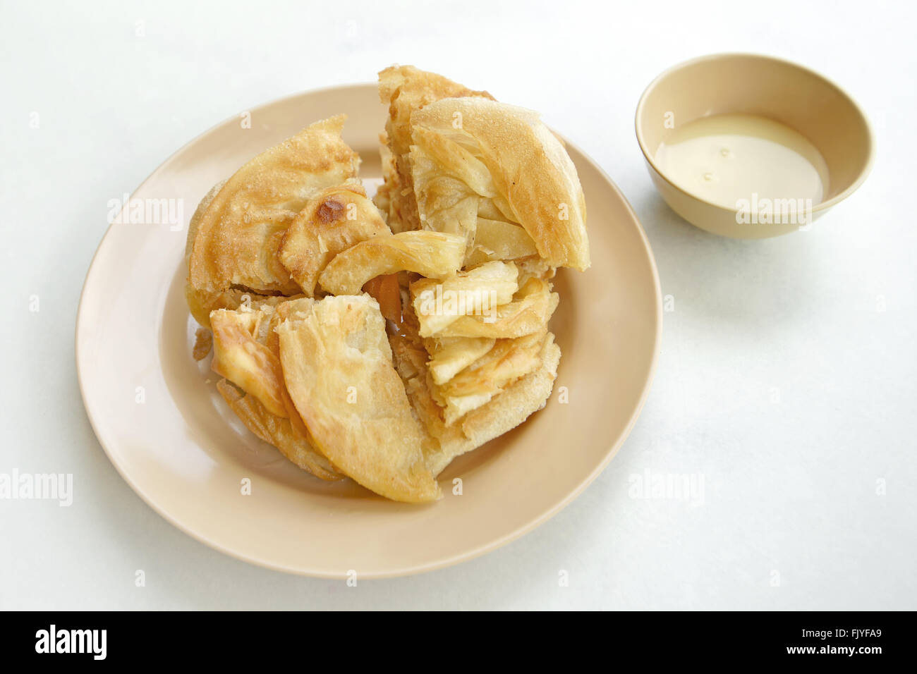 Indian dessert roti con latte condensato zuccherato Foto Stock
