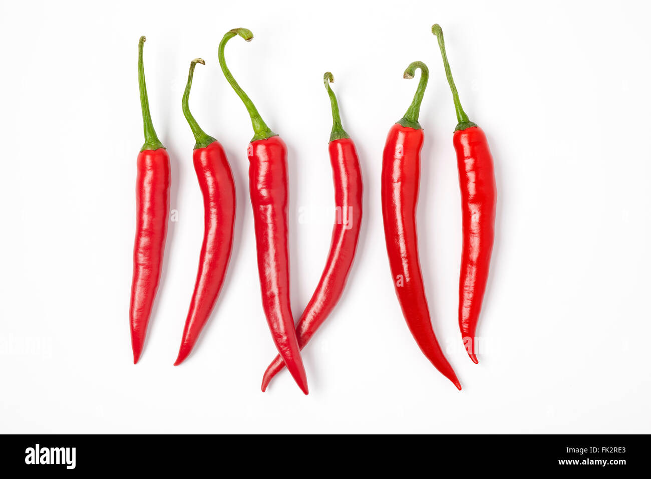Sei nuovi Red Hot Chili Peppers in una riga su sfondo bianco Foto Stock
